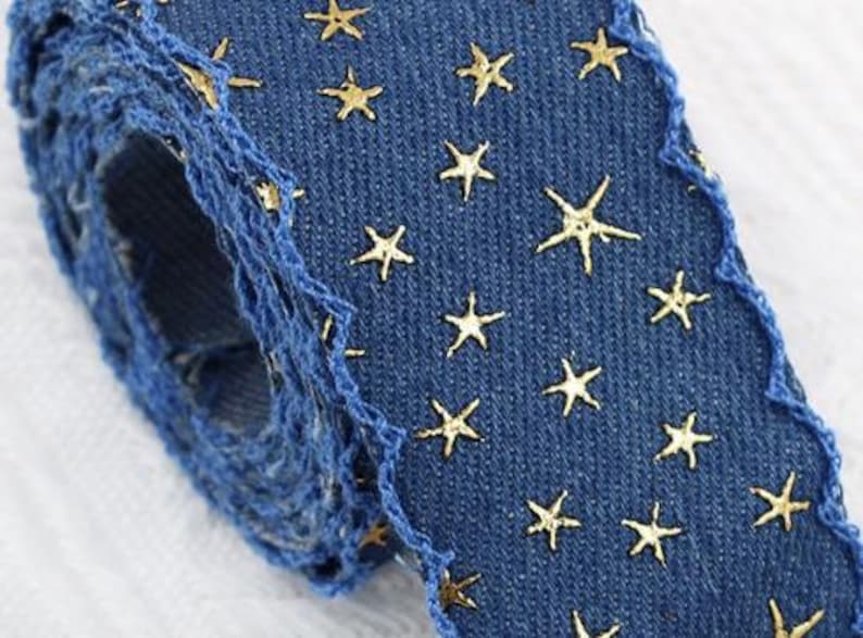 1.	Denim ribbon with embossed star pattern 
2.	Vintage washed denim ribbon for DIY crafts 
3.	3D star textured ribbon close-up 
4.	Blue jean ribbon with decorative edge trim 
5.	Black denim ribbon for fashion accessories 
6.	Textured ribbon for hair bow making 
7.	Assorted denim ribbons in multiple shades 
8.	Fabric ribbon for clothing embellishment 
9.	Stylish denim trim for handmade projects 
10.	Wide denim ribbon rolls for crafts