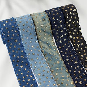 1.	Denim ribbon with embossed star pattern 
2.	Vintage washed denim ribbon for DIY crafts 
3.	3D star textured ribbon close-up 
4.	Blue jean ribbon with decorative edge trim 
5.	Black denim ribbon for fashion accessories 
6.	Textured ribbon for hair bow making 
7.	Assorted denim ribbons in multiple shades 
8.	Fabric ribbon for clothing embellishment 
9.	Stylish denim trim for handmade projects 
10.	Wide denim ribbon rolls for crafts