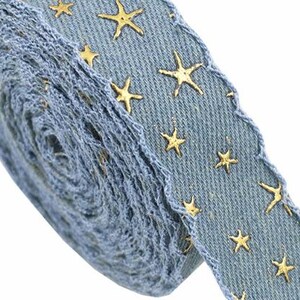 1.	Denim ribbon with embossed star pattern 
2.	Vintage washed denim ribbon for DIY crafts 
3.	3D star textured ribbon close-up 
4.	Blue jean ribbon with decorative edge trim 
5.	Black denim ribbon for fashion accessories 
6.	Textured ribbon for hair bow making 
7.	Assorted denim ribbons in multiple shades 
8.	Fabric ribbon for clothing embellishment 
9.	Stylish denim trim for handmade projects 
10.	Wide denim ribbon rolls for crafts