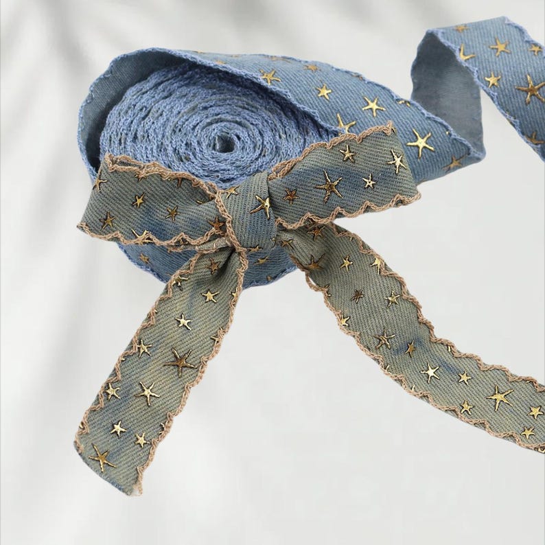 1.	Denim ribbon with embossed star pattern 
2.	Vintage washed denim ribbon for DIY crafts 
3.	3D star textured ribbon close-up 
4.	Blue jean ribbon with decorative edge trim 
5.	Black denim ribbon for fashion accessories 
6.	Textured ribbon for hair bow making 
7.	Assorted denim ribbons in multiple shades 
8.	Fabric ribbon for clothing embellishment 
9.	Stylish denim trim for handmade projects 
10.	Wide denim ribbon rolls for crafts