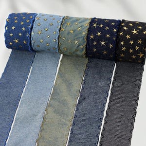 1.	Denim ribbon with embossed star pattern 
2.	Vintage washed denim ribbon for DIY crafts 
3.	3D star textured ribbon close-up 
4.	Blue jean ribbon with decorative edge trim 
5.	Black denim ribbon for fashion accessories 
6.	Textured ribbon for hair bow making 
7.	Assorted denim ribbons in multiple shades 
8.	Fabric ribbon for clothing embellishment 
9.	Stylish denim trim for handmade projects 
10.	Wide denim ribbon rolls for crafts