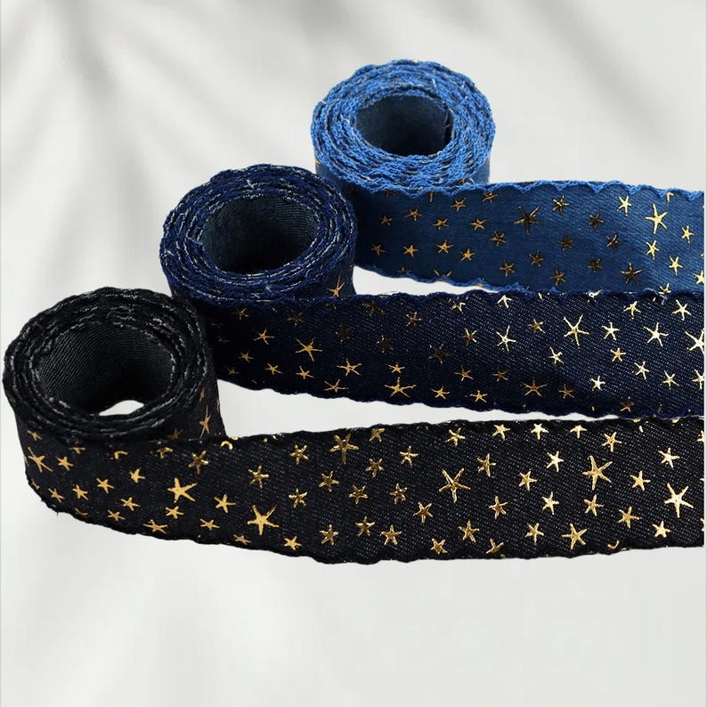 1.	Denim ribbon with embossed star pattern 
2.	Vintage washed denim ribbon for DIY crafts 
3.	3D star textured ribbon close-up 
4.	Blue jean ribbon with decorative edge trim 
5.	Black denim ribbon for fashion accessories 
6.	Textured ribbon for hair bow making 
7.	Assorted denim ribbons in multiple shades 
8.	Fabric ribbon for clothing embellishment 
9.	Stylish denim trim for handmade projects 
10.	Wide denim ribbon rolls for crafts