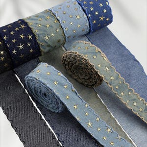 1.	Denim ribbon with embossed star pattern 
2.	Vintage washed denim ribbon for DIY crafts 
3.	3D star textured ribbon close-up 
4.	Blue jean ribbon with decorative edge trim 
5.	Black denim ribbon for fashion accessories 
6.	Textured ribbon for hair bow making 
7.	Assorted denim ribbons in multiple shades 
8.	Fabric ribbon for clothing embellishment 
9.	Stylish denim trim for handmade projects 
10.	Wide denim ribbon rolls for crafts