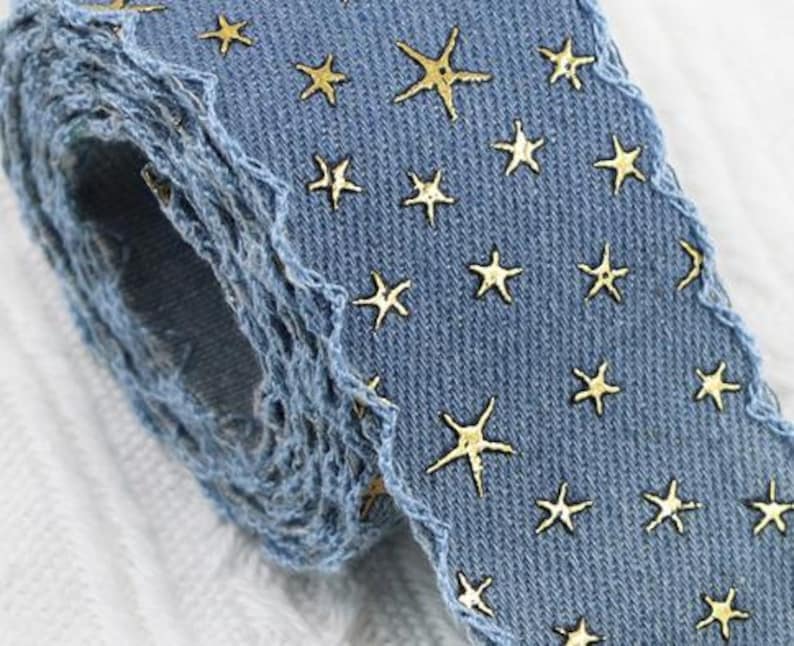 1.	Denim ribbon with embossed star pattern 
2.	Vintage washed denim ribbon for DIY crafts 
3.	3D star textured ribbon close-up 
4.	Blue jean ribbon with decorative edge trim 
5.	Black denim ribbon for fashion accessories 
6.	Textured ribbon for hair bow making 
7.	Assorted denim ribbons in multiple shades 
8.	Fabric ribbon for clothing embellishment 
9.	Stylish denim trim for handmade projects 
10.	Wide denim ribbon rolls for crafts
