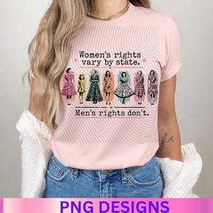 May include: A light pink t-shirt featuring a graphic print of seven vintage-style figures in dresses. The text reads: Women's rights vary by state. Men's rights don't. The design includes thin, wavy black lines radiating across the chest area.