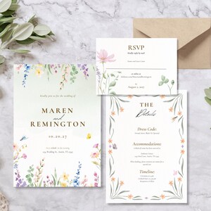 May include: Wedding invitation suite with floral watercolor design. The invitation includes the names "Maren and Remington" and the date "10.20.27". The suite also includes an RSVP card and a details card with dress code and accommodation information.