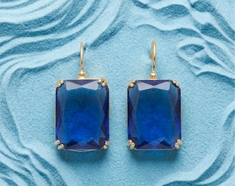 Dangle earrings with rectangular-cut blue stones
