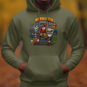 May include: An olive green hooded sweatshirt featuring a graphic print of a character labeled WEBMASTER. The design includes a figure holding a sword and shield, surrounded by colorful cartoon icons, a beer mug, and various digital-themed elements.