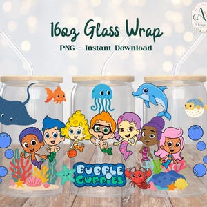 May include: Three 16oz glass wrap tumblers with cartoon sea creature and Bubble Guppies designs. Each glass has a bamboo lid and a clear straw. The designs include a stingray, goldfish, jellyfish, dolphin, and pufferfish, with Bubble Guppies characters.