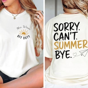 May include: A cream-colored t-shirt featuring a small graphic on the front left chest with a sun icon and the text Mrs. Wison OFF DUTY. The back displays the large black and gold text SORRY. CAN'T. SUMMER. BYE. with a small heart and paper airplane.