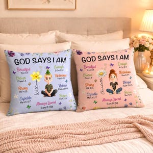 May include: Two square throw pillows featuring the text GOD SAYS I AM, with lists of affirmations and Bible verses. One pillow is light blue with a cartoon boy named William, the other is light pink with a cartoon girl named Charlotte.