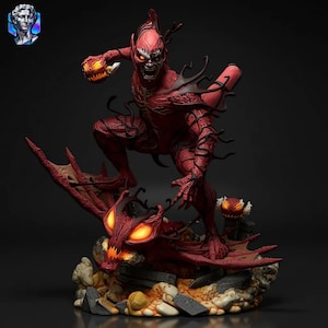 May include: A red and black figurine of a demonic creature with glowing orange eyes, holding a jack-o'-lantern. The figure is posed on a rocky base with a dragon-like creature. A smaller jack-o'-lantern is also present.