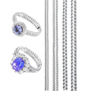 May include: Two silver rings with adjustable coil bands and blue gemstones surrounded by small clear stones, positioned next to four vertical silver snake chains. The top ring features a round blue stone, while the bottom ring has a rectangular blue stone.