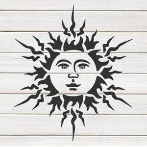 May include: A black sun design with a face, surrounded by stylized flames and rays. The sun graphic is centered on a white wooden plank background, creating a striking contrast. The design is suitable for various applications.