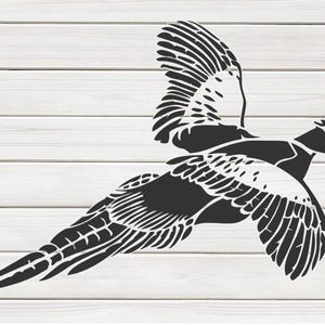 May include: A black and white illustration of a pheasant in flight. The bird is depicted with its wings spread wide, showcasing detailed feather patterns. The background is a light wood grain.