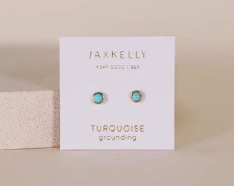 May include: Turquoise gemstone stud earrings on a white card with the text "JAXKELLY WEAR GOOD VIBES TURQUOISE grounding"