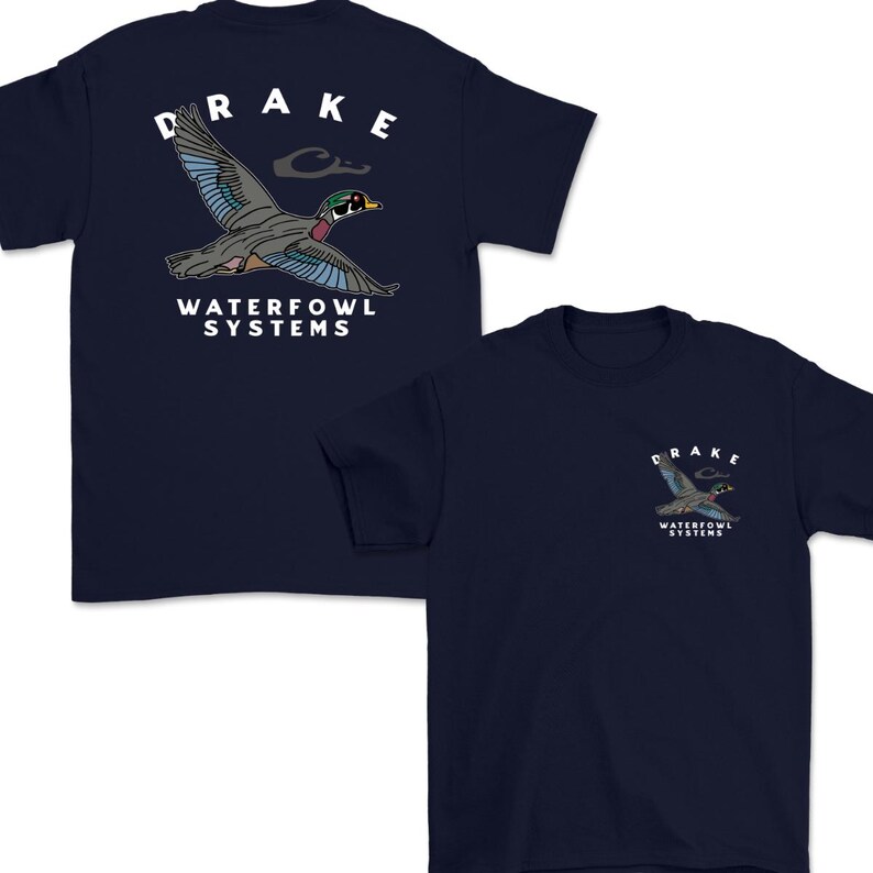 May include: Navy blue t-shirts with a duck graphic. The front of the shirt has a small duck graphic with the word "DRAKE" above it and "WATERFOWL SYSTEMS" below. The back of the shirt has a larger duck graphic with the same text.