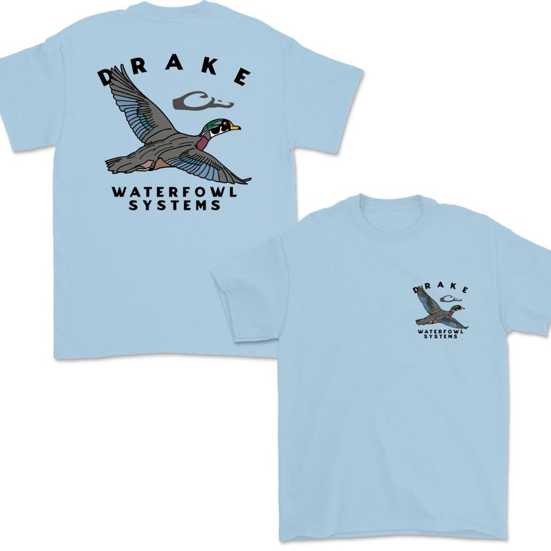 May include: Light blue t-shirts with a duck graphic. The shirts feature the word "DRAKE" above a flying duck illustration, and "WATERFOWL SYSTEMS" below. One shirt has the graphic on the back, and the other on the front.