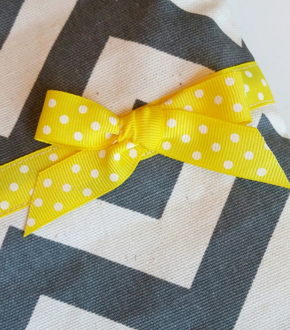 yellow and gray gift bags
