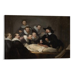 May include: A framed canvas print of Rembrandt's "The Anatomy Lesson of Dr. Nicolaes Tulp." The painting depicts a group of men observing a dissection. The scene is set in a dimly lit room, with the figures arranged around a table.