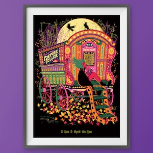 May include: A colorful, vintage-style fortune teller wagon with a black silhouette of a crow on the roof. The wagon is decorated with stars, moons, and other mystical symbols. The text "Fortune Teller" is written on the side of the wagon. A person is sitting on the steps of the wagon, reading a book. The text "I Put A Spell On You" is written at the bottom of the image.