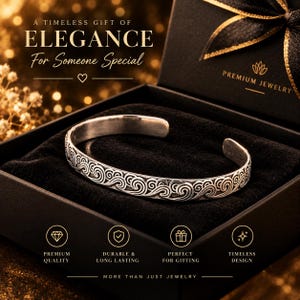 May include: A silver cuff bracelet featuring an embossed wave pattern, presented in a black box with the text A TIMELESS GIFT OF ELEGANCE For Someone Special, PREMIUM JEWELRY, PREMIUM QUALITY, DURABLE & LONG LASTING, PERFECT FOR GIFTING, and TIMELESS DESIGN.
