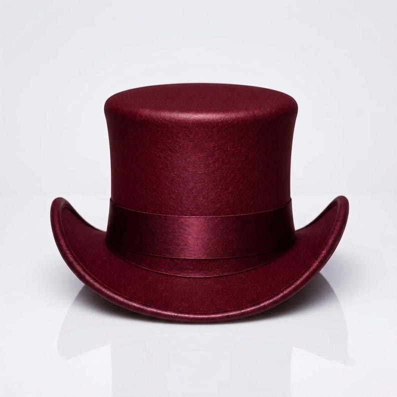 May include: A deep burgundy top hat with a flat crown and a curved brim. The hat features a matching satin ribbon band wrapped around the base of the crown, providing a smooth, uniform texture across the entire surface of the headwear piece.