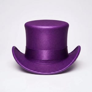 May include: A solid purple top hat with a flat crown and a curved brim. The hat features a matching purple satin-finish ribbon band wrapped around the base of the crown, creating a uniform monochromatic appearance with a smooth, matte texture.