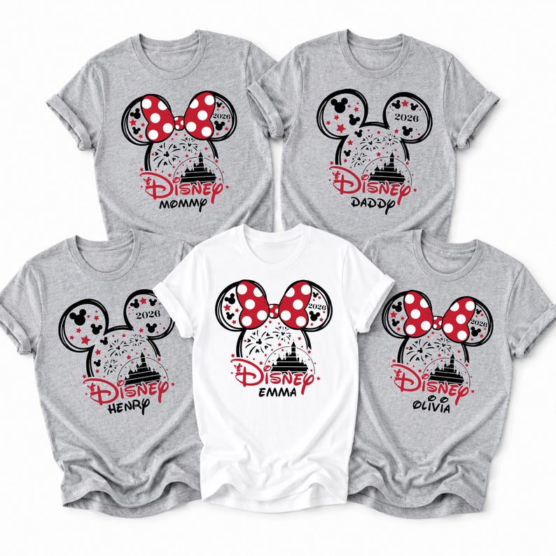 May include: Five gray and white t-shirts with a Disney theme. Each shirt features a Minnie Mouse design with a red bow, fireworks, and the word "Disney". The shirts are labeled "Mommy", "Daddy", "Henry", "Emma", and "Olivia".