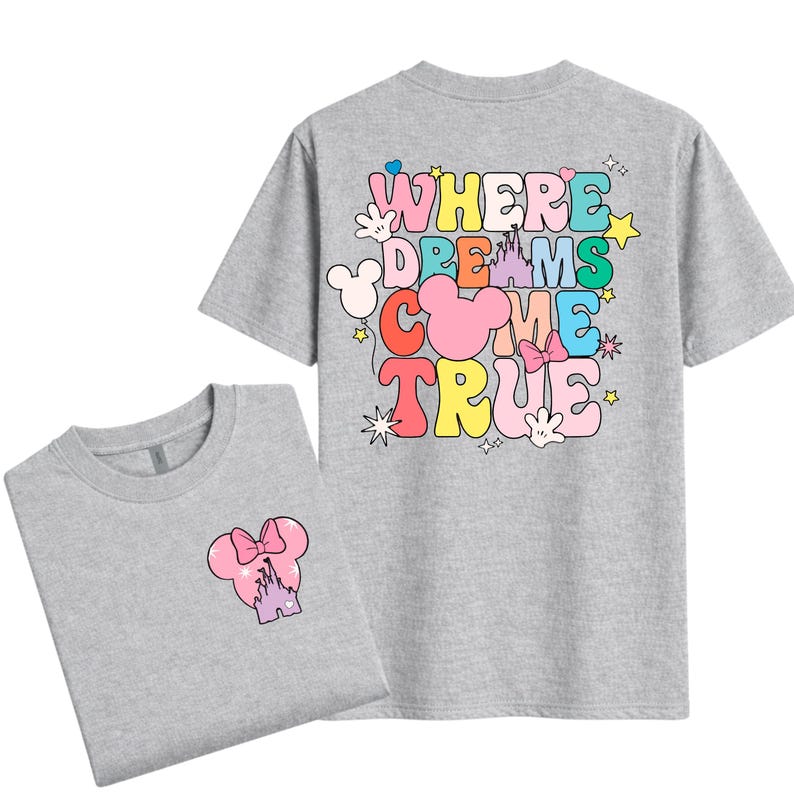 May include: Two grey t-shirts. One has a small graphic of a pink Minnie Mouse head with a castle and bow. The other has the text "WHERE DREAMS COME TRUE" in colourful bubble letters with Mickey Mouse hands and stars.