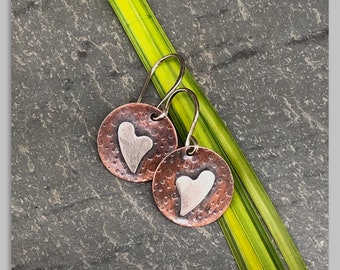 Copper round textured oxidized earrings with soldered on sterling silver hearts