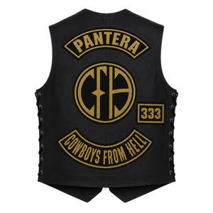 May include: A black sleeveless vest featuring gold embroidered patches on the back. The top patch reads PANTERA, the center circular patch displays the letters CFH, a small rectangular patch reads 333, and the bottom patch reads COWBOYS FROM HELL.