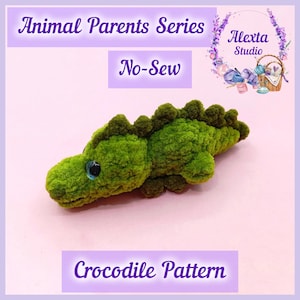 May include: A green plush crocodile toy with a textured surface and dark eyes. The image includes text reading Animal Parents Series, No-Sew, Alexta Studio, and Crocodile Pattern, set against a light pink background with a floral logo.