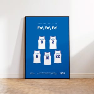 May include: A framed blue poster featuring the text "Philadelphia, PA" and "Fo', Fo', Fo'" above five white basketball jerseys with red and blue trim. The jerseys display the names Iavaroni, Malone, Erving, Cheeks, and Toney with their numbers.