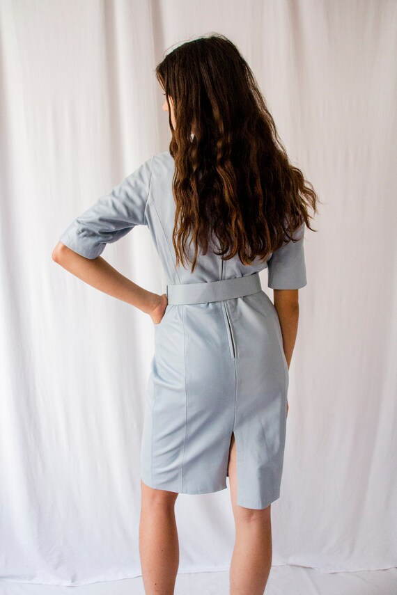 Vintage 1980s baby blue leather dress with round belt… Gem