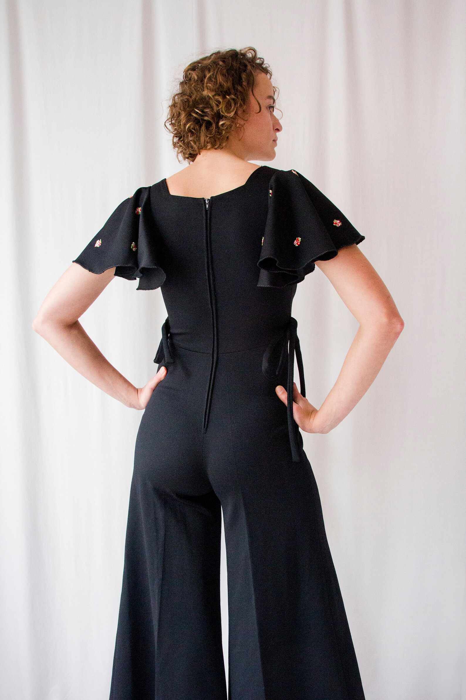 1970s Black Crepe Flared Leg Jumpsuit With Ruffled Sleeves // - Etsy ...