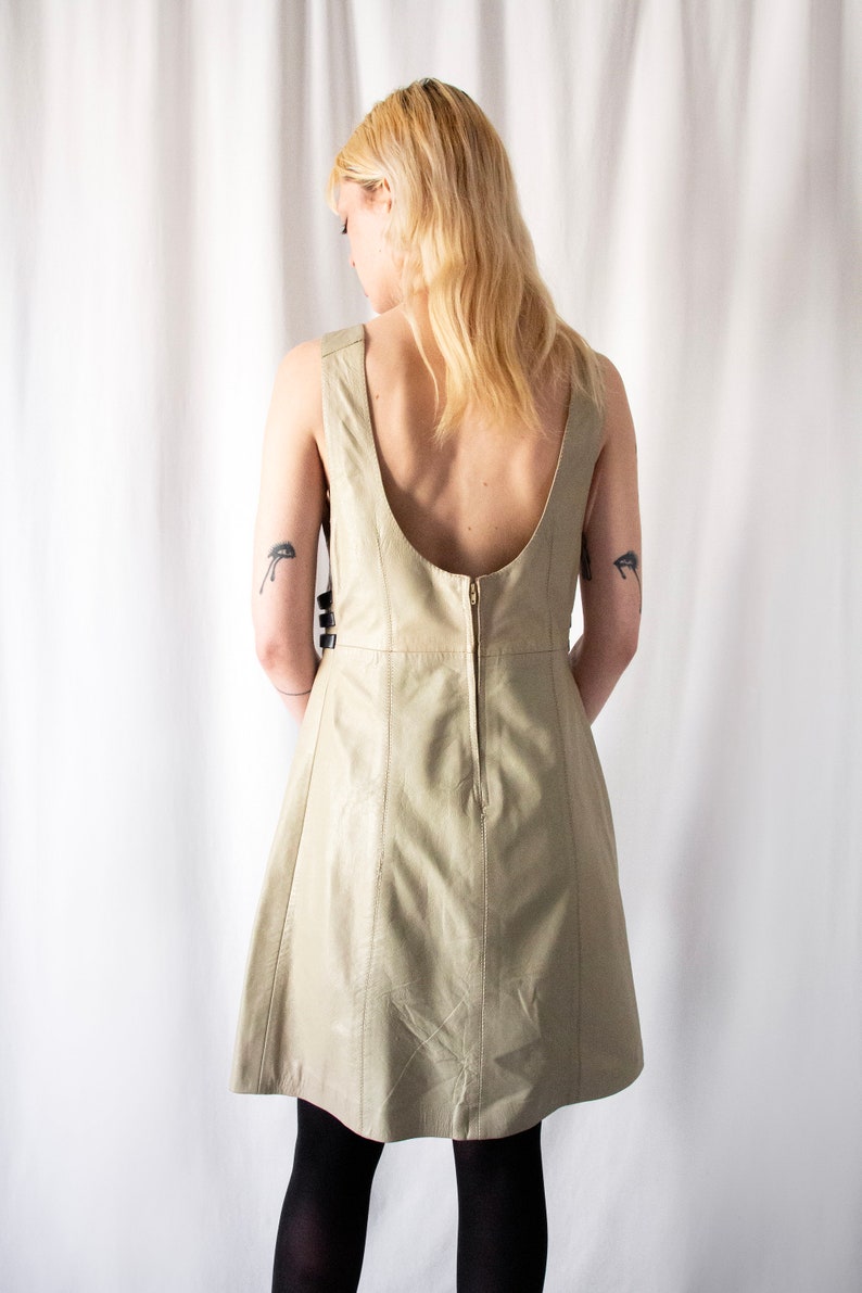 1960s Italian made A line taupe leather dress with gold buckle details // Vintage 60s Mod scooter space age round collar backless mini dress image 2