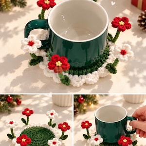 Puede incluir: Una taza de cerámica verde oscuro sobre un posavasos redondo de ganchillo. El posavasos presenta un centro verde oscuro, un borde festoneado blanco y varias flores de ganchillo tridimensionales en rojo y blanco con tallos y hojas verdes.