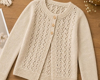 May include: A beige long-sleeve knit cardigan featuring a delicate openwork diamond pattern on the front panels. The garment has a round neckline, ribbed cuffs and hem, and is fastened with three small, round, light-colored wooden buttons.