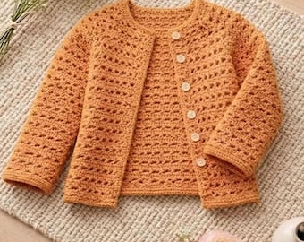 May include: A long-sleeved, orange crochet cardigan featuring a round neckline and a front button closure with six light-colored buttons. The garment has a textured, open-stitch pattern throughout. A circular white label displays the text Pattern Only.