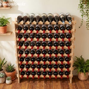 May include: A wooden wine rack filled with numerous wine bottles. The rack is made of light-colored wood and has multiple shelves to hold the bottles. The bottles are dark with red capsules, and the rack is positioned against a neutral background.