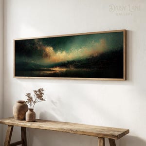 May include: A rectangular landscape wall art piece in a wooden frame featuring a dark, textured abstract scene with deep green, black, and golden yellow hues. The artwork depicts a horizon line with light reflecting over a dark, shadowed landscape.