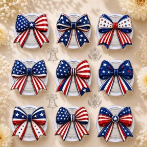 May include: A collection of nine decorative bow-shaped ornaments arranged in a grid. Each bow features a patriotic colour scheme of red, white, and blue, incorporating various patterns of stars and stripes. The bows are mounted on circular bases.