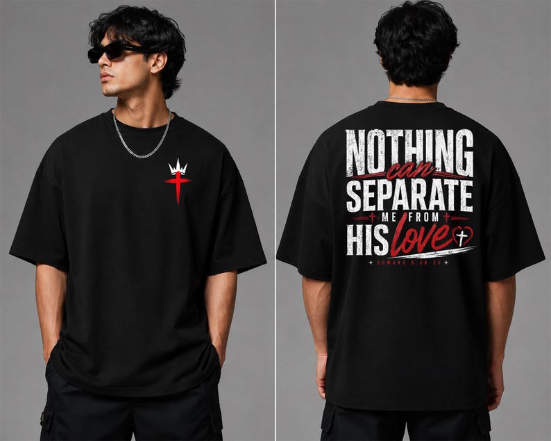 May include: A black short-sleeve t-shirt featuring a small red cross and white crown graphic on the front left chest. The back displays the white and red text "NOTHING CAN SEPARATE ME FROM HIS love" with a heart and cross symbol and "ROMANS 8:38-39".