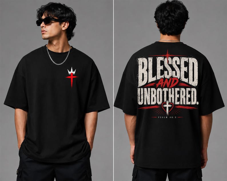 May include: A black short-sleeve t-shirt featuring a small white crown and red cross graphic on the front chest. The back displays the text BLESSED AND UNBOTHERED in large white letters with a red cross, heart, and the text PSALM 46:5 below.