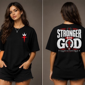 May include: A black short-sleeve t-shirt featuring a small red cross and white crown graphic on the front chest. The back displays the large white text STRONGER WITH GOD, a red cross, and the smaller text FAITH OVER FEAR VICTORY EVERY DAY.