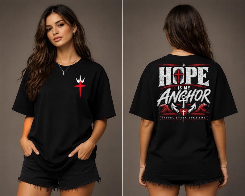May include: A black short-sleeve t-shirt featuring a small red cross with a white crown on the front chest. The back displays the text HOPE IS MY ANCHOR in white, with a large anchor, a red heart, and red waves, plus the text STRONG, STEADY, UNWAVERING.