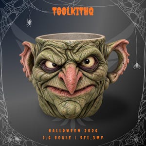 May include: A green, textured mug shaped like a goblin face with large ears, a pointed nose, and a scowling expression. The text TOOLKITHQ is at the top, and HALLOWEEN 2026 1:6 SCALE | STL, 3MF is at the bottom against a dark spiderweb background.