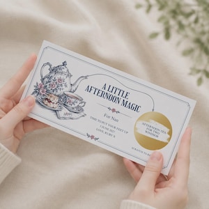 May include: A rectangular gift voucher featuring a vintage-style illustration of a floral teapot, teacup, and scone. The text reads A LITTLE AFTERNOON MAGIC, For Nan, 5 JUNE 2027, LOVE, RUBY X, and includes a circular gold scratch-off panel.