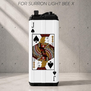 May include: A rectangular battery sticker for a Surron Light Bee X featuring a Jack of Spades playing card design. The graphic displays a red and black court figure with the letter J and spade symbols. The top text reads BATTERY STICKERS FOR SURRON LIGHT BEE X.